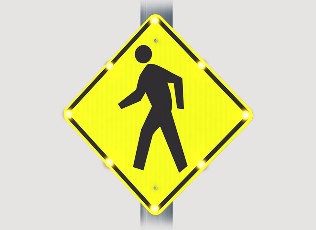 blinking warning sign of a pedestrian walking