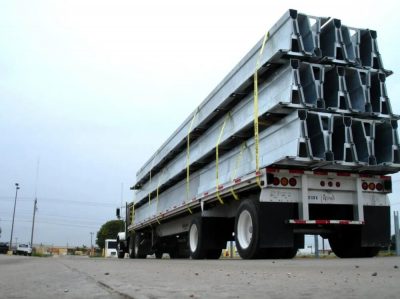 Portable Barrier Walls stacked on the back of a truck